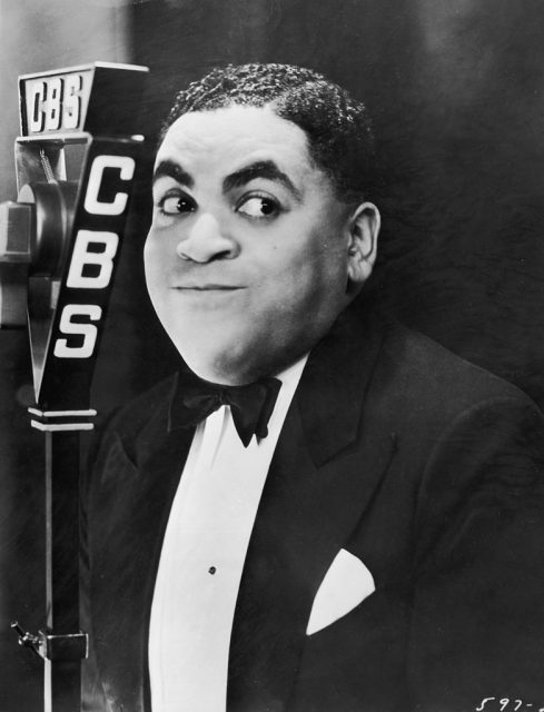 Fats Waller standing before a microphone