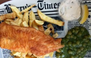 Fish and chips served on a newspaper