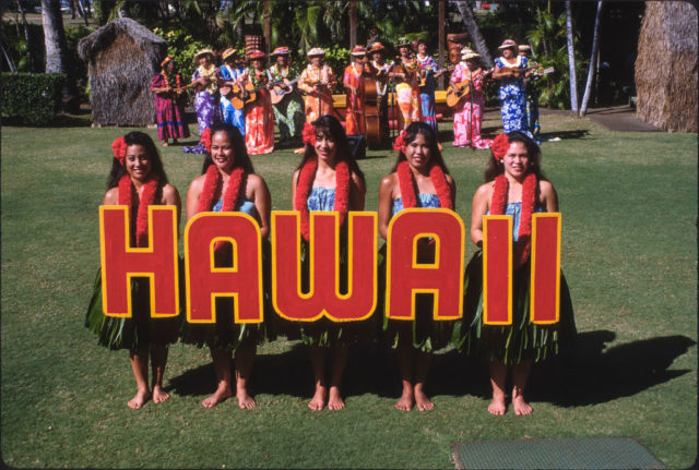 Hula dancers spell the state name