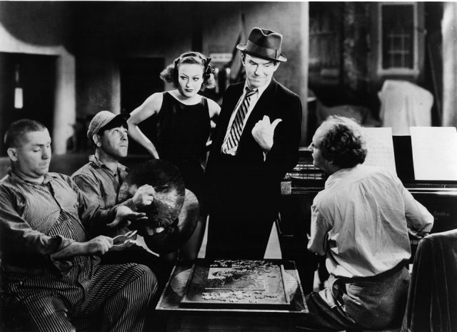 Curly Howard, Moe Howard, Joan Crawford, Ted Healy, and Larry Fine in a scene from the film ‘Dancing Lady’, 1933. (Photo Credit: Metro-Goldwyn-Mayer/Getty Images)