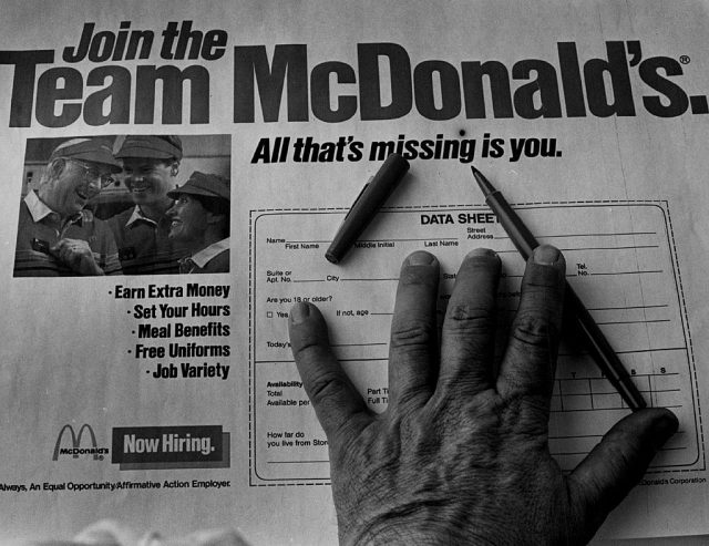 Hand atop a McDonald's job application