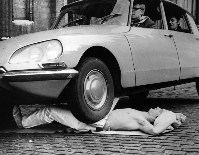 Fakir Mirah Soumak lying below a car