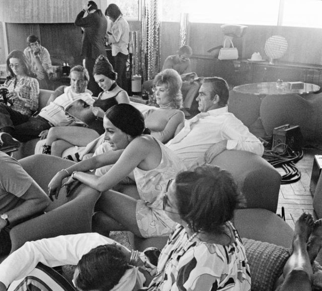 Sean Connery and actresses relax between takes on the set of the James Bond film ‘Diamonds Are Forever’, USA, 1971. (Photo Credit: Anwar Hussein/Getty Images)