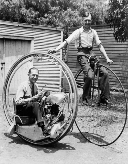 A man on a penny-farthing bicycle alongside Walter Nilsson (left) aboard the Nilsson monowheel, 1935. (Photo Credit: FPG/Hulton Archive/Getty Images)