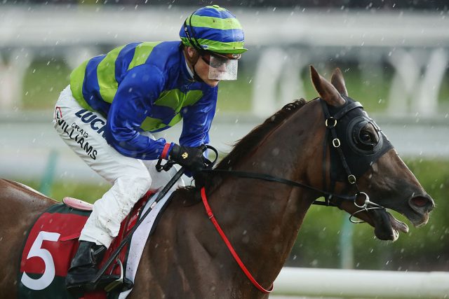 Jockey Craig Williams riding Miss Idyllic wears a visor in front of his goggles. (Photo Credit: Michael Dodge/Getty Images)