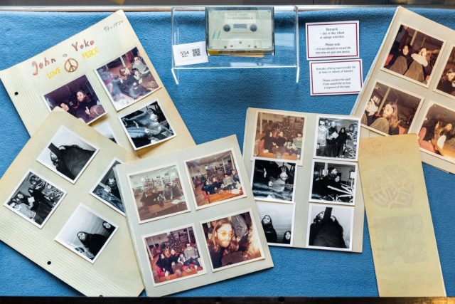 Cassette tape surrounded by polaroids of John Lennon and Yoko Ono