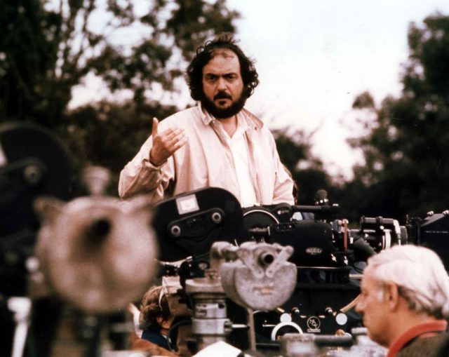 Director Stanley Kubrick overlooks cameramen while filming 