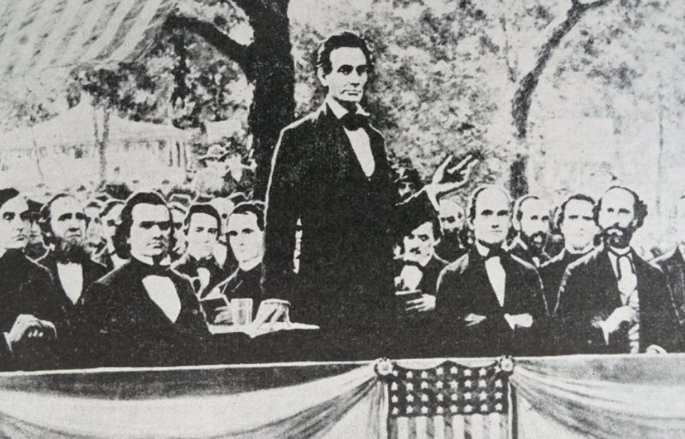 Abraham Lincoln (standing) in one of a series of seven debates regarding slavery with Stephen Douglas (at Lincoln's right), his rival for a seat in the Senate. These debates permitted both candidates to discuss their views on slavery. (Photo Credit: Universal History Archive/UIG via Getty images)