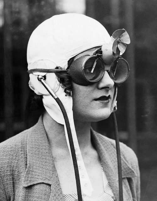 A woman race car driver from England models special rain goggles. 1930s. (Photo Credit: © Hulton-Deutsch Collection/CORBIS/Corbis via Getty Images)