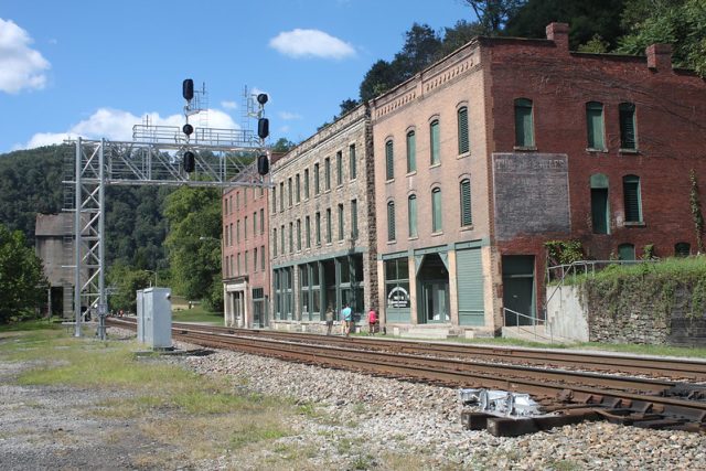 Brick buildings along railroad tracks