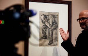 Man motioning toward Study of Worn Out