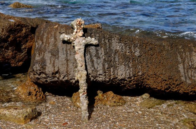 Crusades sword leaning against a rock