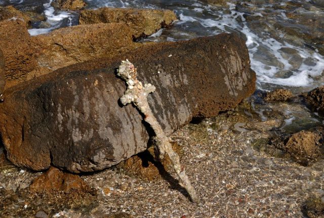 Crusades sword leaning against a rock