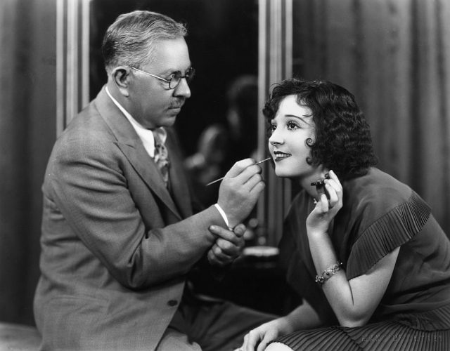 Max Factor (1877-1938), Polish businessman and founder of cosmetics company, Max Factor, demonstrates the technique of applying lipstick, circa 1930. (Photo Credit: Margaret Chute/Hulton Archive/Getty Images)