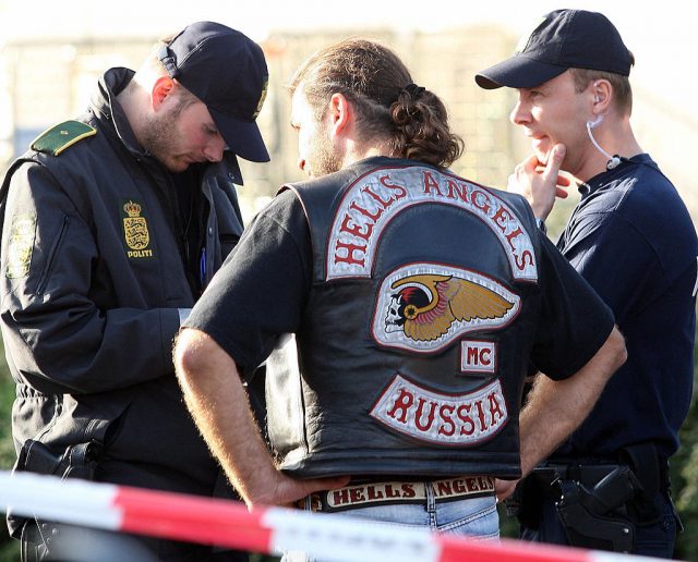 A Hells Angels (HA) member from Russia is controlled by Danish police outside a Hells Angels owned building in Ishoej south of Copenhagen, Denmark, 25 August 2007. (Photo Credit: MOGENS FLINDT/AFP via Getty Images)