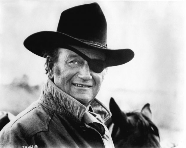 John Wayne, in his Oscar winning performance as Rooster Cogburn, in scene from the movie True Grit (Photo Credit: Michael Ochs Archives/Getty Images)