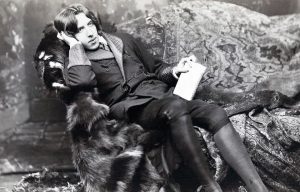 black and white photo of Oscar Wilde gazing into the camera