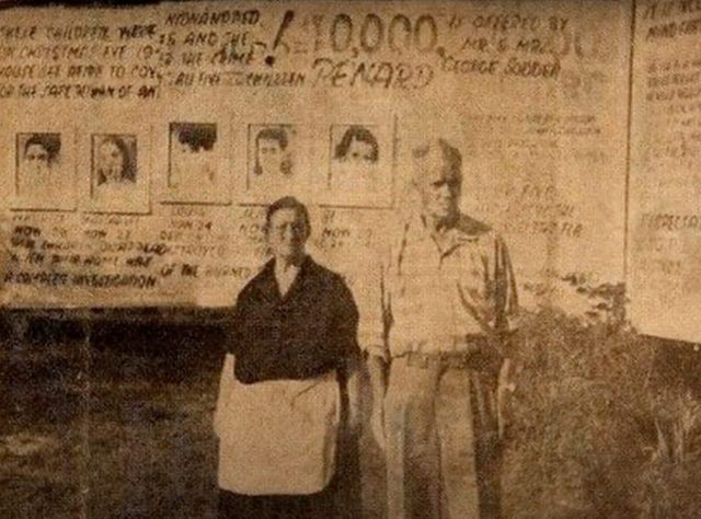 Jennie and George Sodder standing in front of a billboard