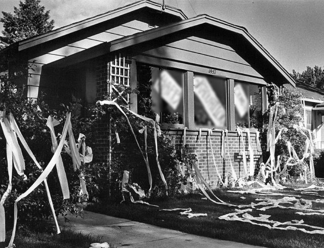 House covered in toilet paper