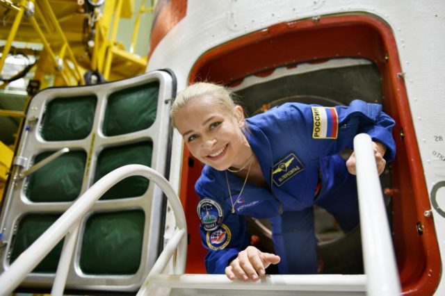 Yulia Peresild stepping out of a space capsule