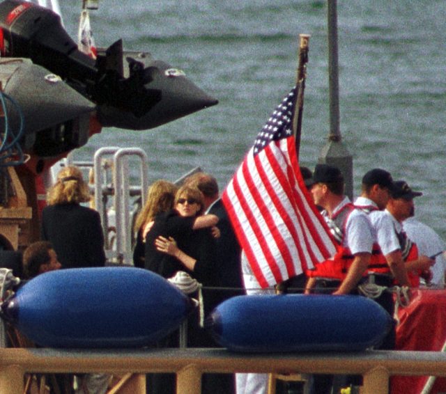 Members of the Kennedy and Bessette families embrace 