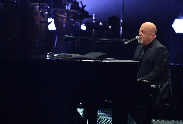 Billy Joel playing the piano