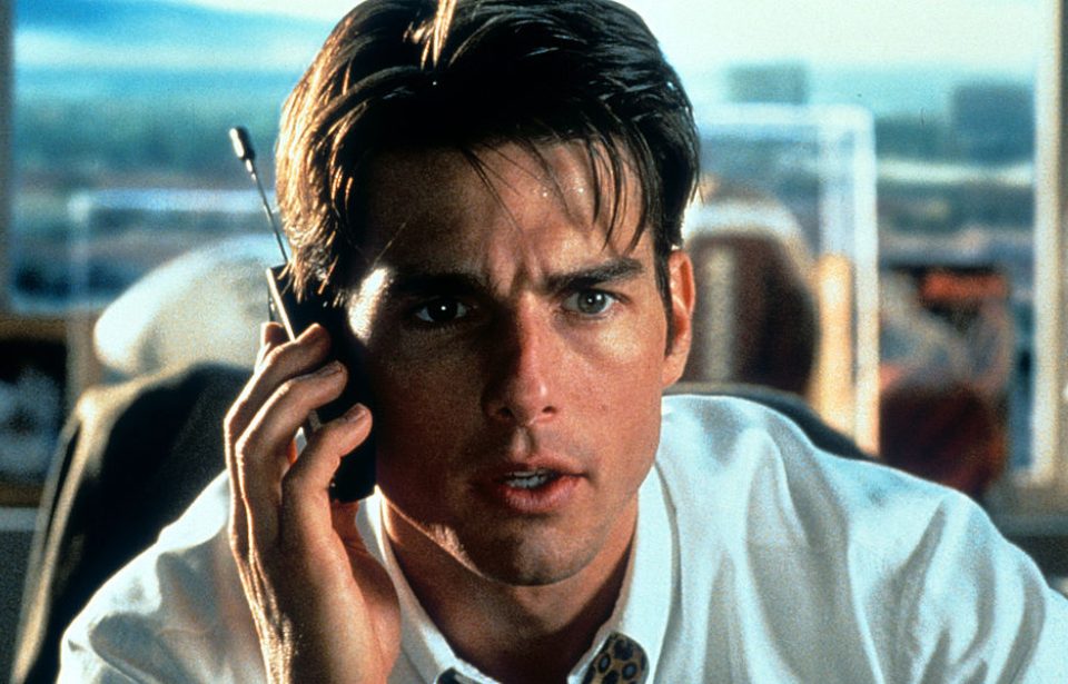 Tom Cruise talks on a phone in a scene from the film 'Jerry Maguire', 1996. (Photo Credit: TriStar/Getty Images)