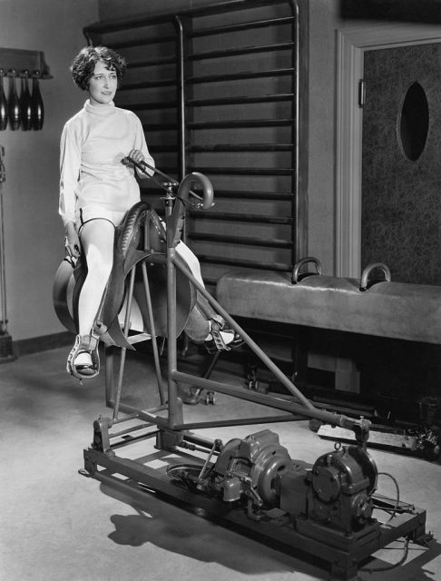 Dorothy Sebastian riding a mechanical horse