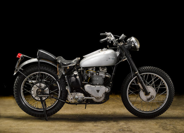 Vintage motorcycle against a black backdrop