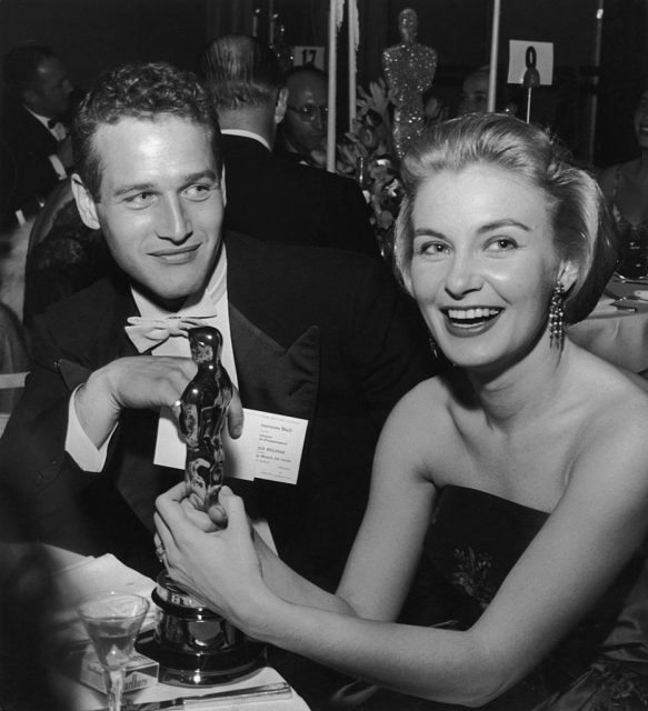 Joanne Woodward holds her Oscar statuette while sitting next to husband, American actor Paul Newman, during the Governor’s Ball, an Academy Awards party held at The Beverly Hilton Hotel, Beverly Hills, California. (Photo Credit: Darlene Hammond/Hulton Archive/Getty Images)