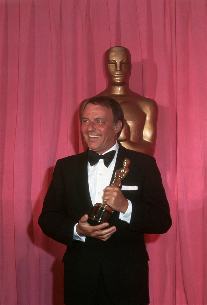 Frank Sinatra holding an Oscar