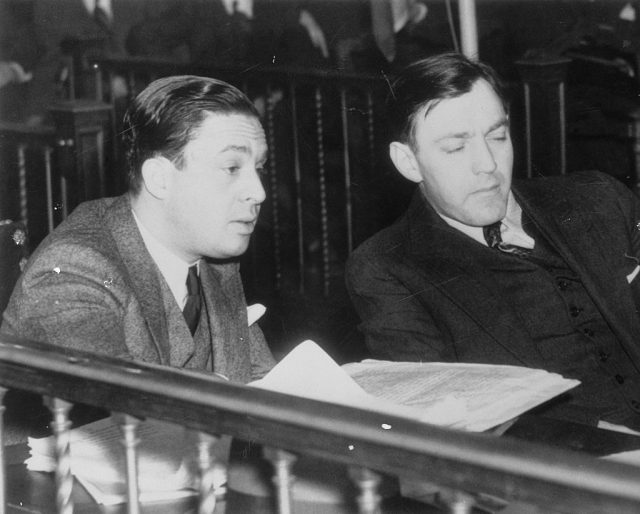 “Dutch” Shultz Flegenheim, (R) and his lawyer, J. Richard Dixie Davis, are pictured here in court where he met with a week’s delay on his fight against removal from Albany to New York for trial. (Photo Credit: Bettmann / Contributor)