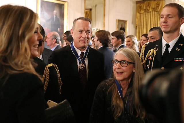 Actor, filmmaker and social justice advocate Tom Hanks (C) and NASA mathematician and computer software pioneer Margaret Hamilton (2nd R) leave an East Room ceremony where they were awarded the Presidential Medal of Freedom. (Photo Credit: Chip Somodevilla/Getty Images)