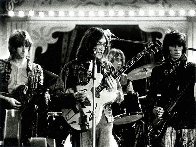 Left to right: Eric Clapton, John Lennon, Mitch Mitchell and Keith Richards performing live onstage as ‘The Dirty Mac’ for ‘The Rolling Stones Rock and Roll Circus’ at Intertel Studio, Wembley, London, 11th December 1968. (Photo Credit: Andrew Maclear/Redferns)