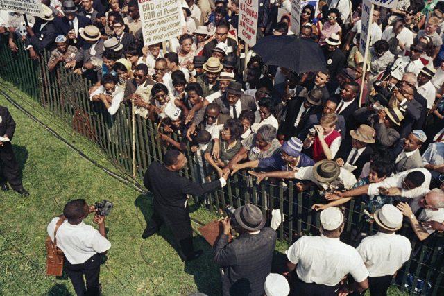 MLK Jr. shaking hands with crowds during the March on Washington 