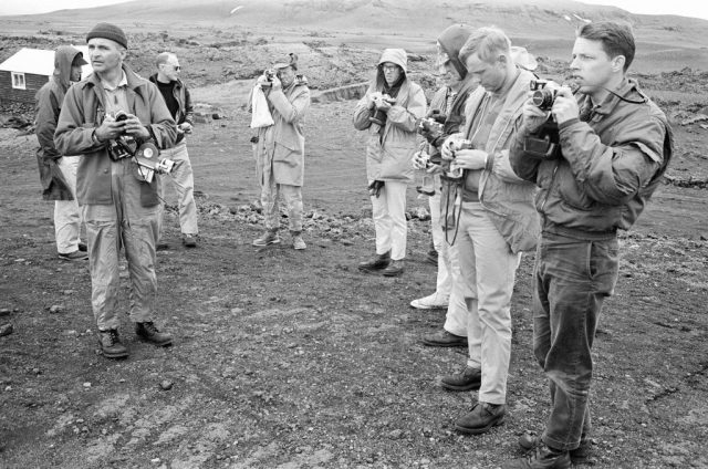 NASA astronauts holding cameras