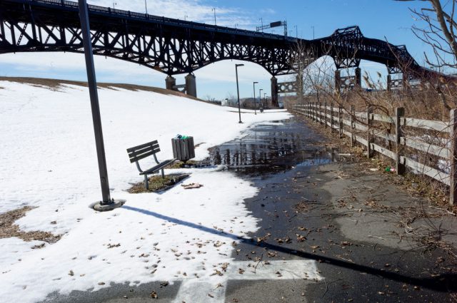 Bridge spanning across a snow-covered path