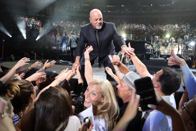 Billy Joel greets fans after a performance