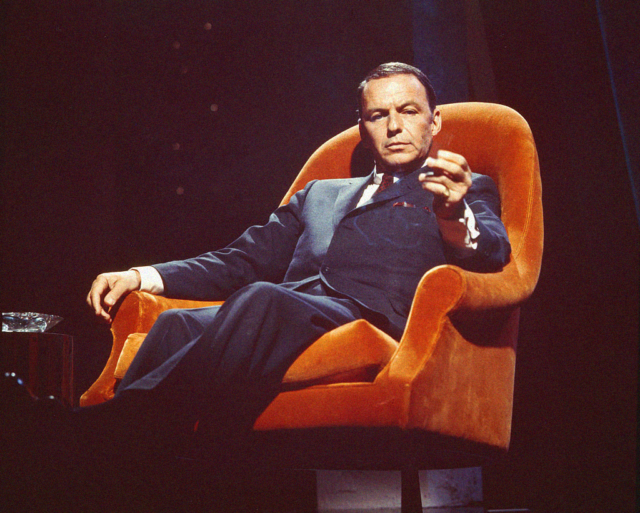 Sinatra in an orange chair