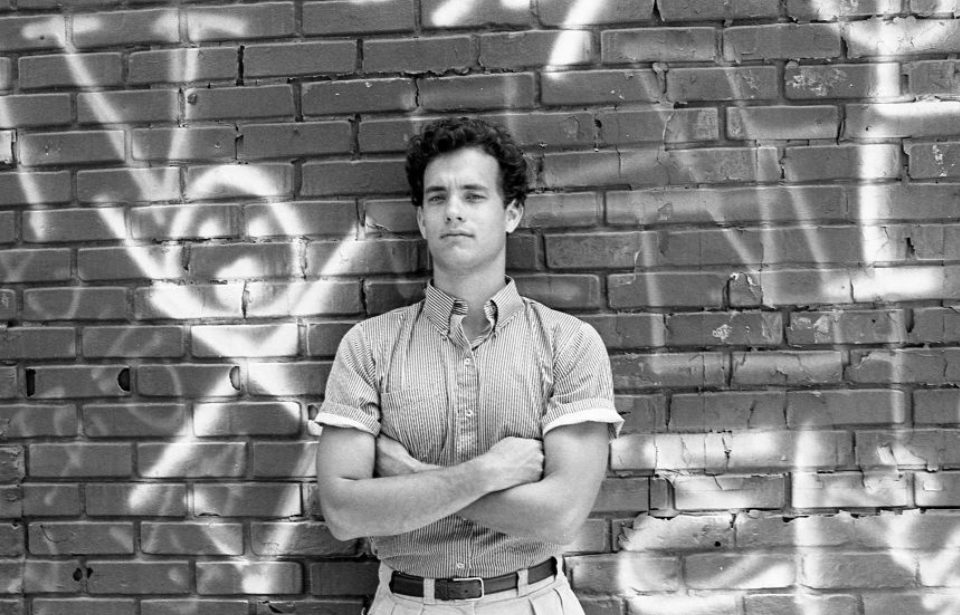 American movie actor Tom Hanks stands in front of graffiti wall on the backlot of 20 Century Fox Studio in Century City, California, circa 1984 (Photo Credit: Nik Wheeler/Corbis via Getty Images)