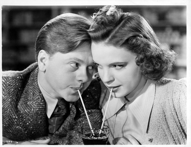 Mickey Moran and Patsy Barton sipping a drink together