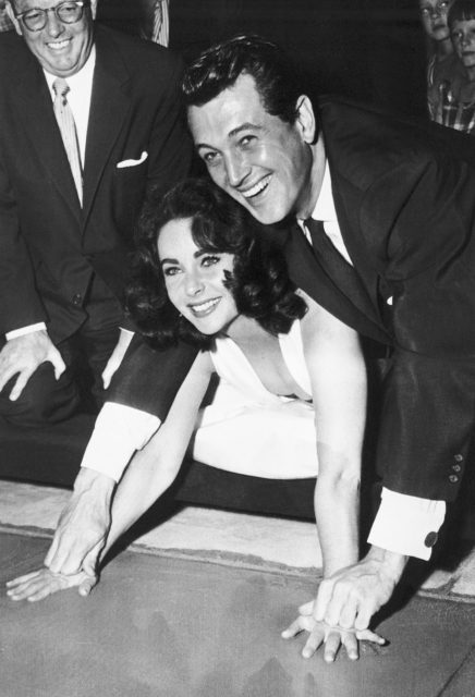 Elizabeth Taylor gets an assist from actor Rock Hudson