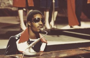 American singer-songwriter and keyboard player Stevie Wonder performs on a television show in London