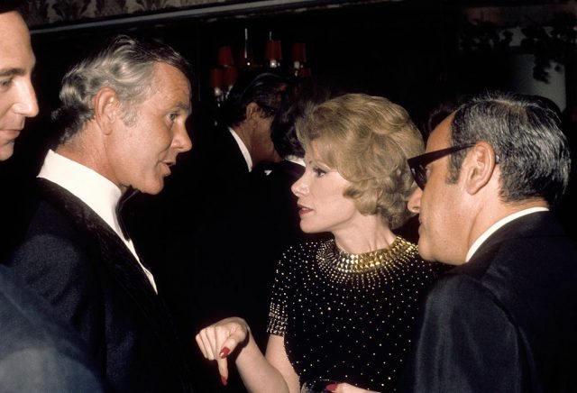 Johnny Carson greets comedienne Joan Rivers