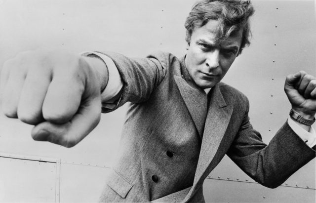 Michael Caine throwing a punch