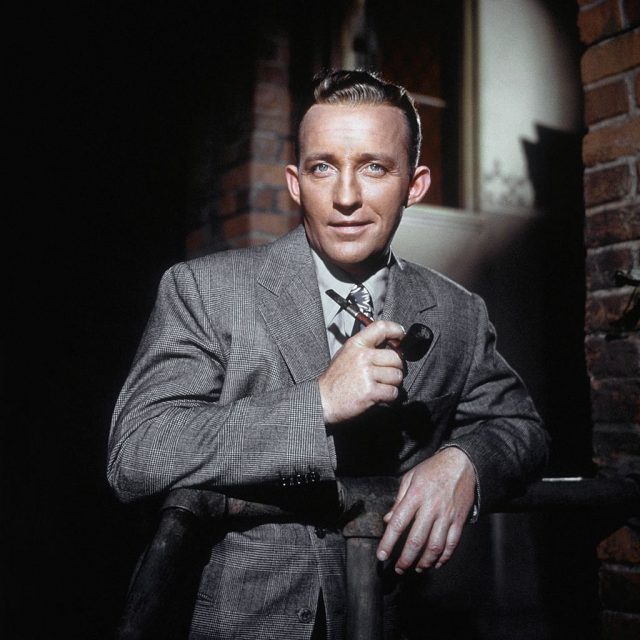 Bing Crosby poses for a portrait with pipe