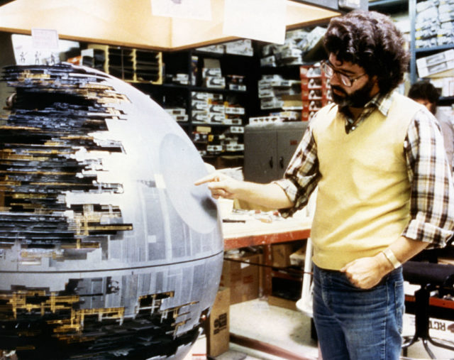 George Lucas pointing at the Death Star