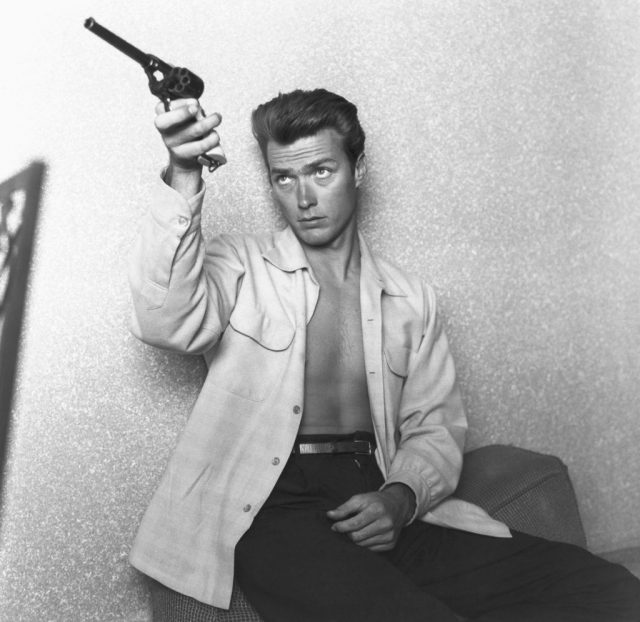 Clint Eastwood checks his gun