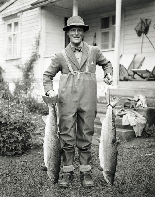 Angler holding up a pair of salmon