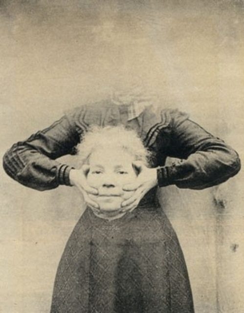 Woman holding her head in her hands